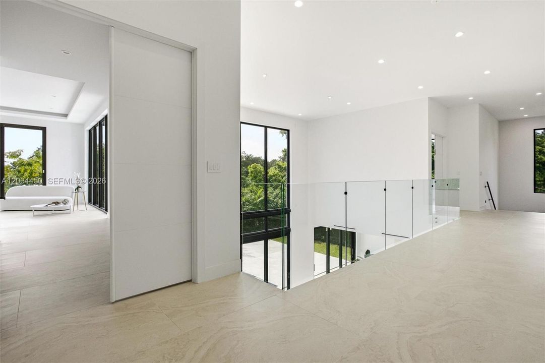 Hallway with glass doors to the patio