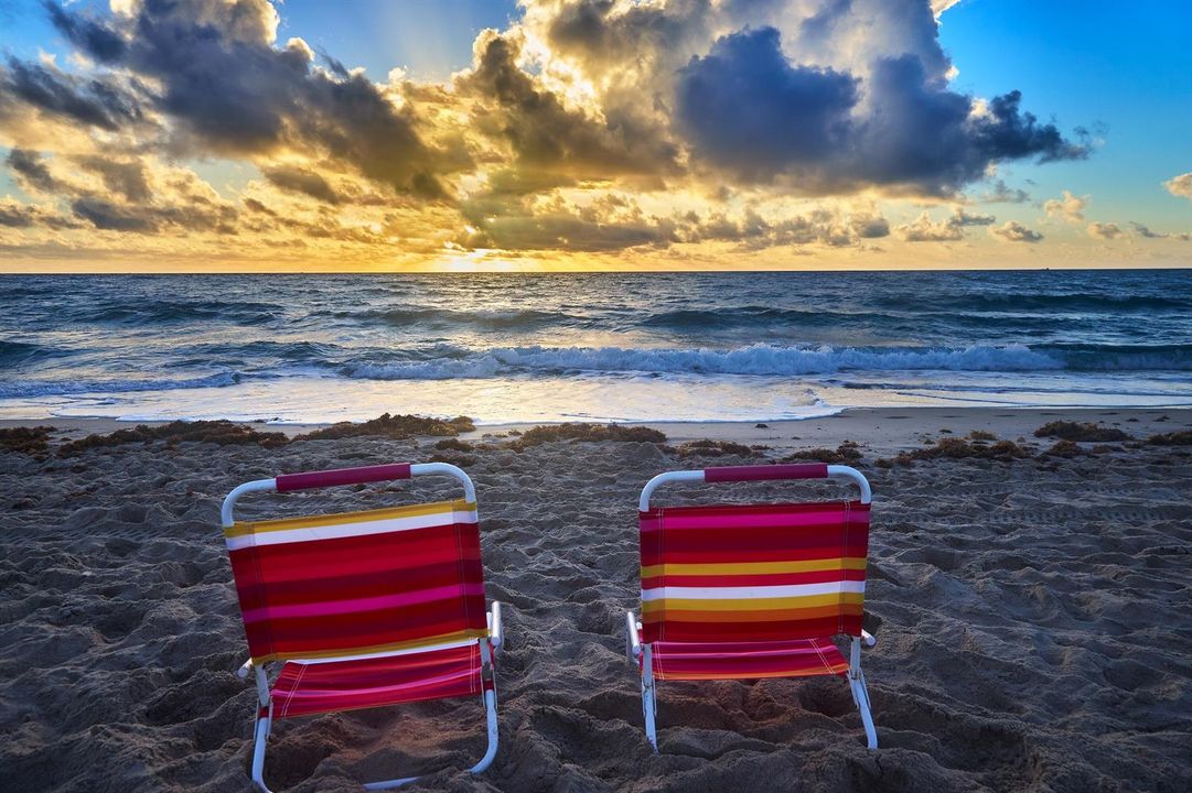 BEACH CHAIRS IN THE SAND
