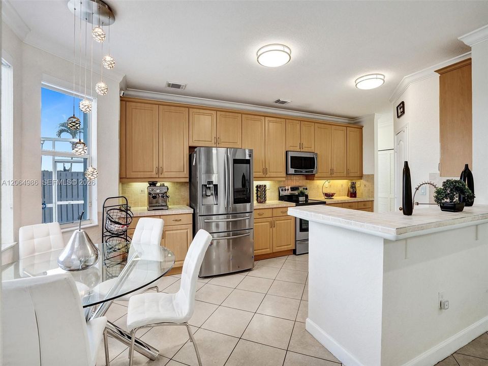 ANOTHER VIEW OF KITCHEN AND BREAKFAST NOOK.