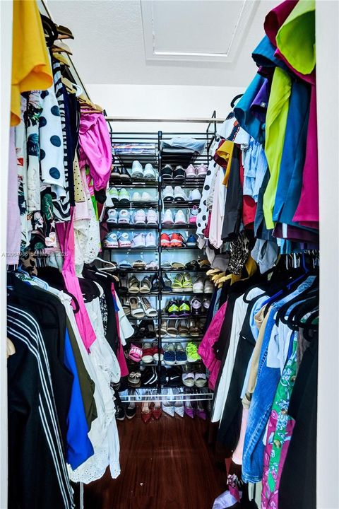 PRIMARY BEDROOM WITH HIS AND HER WALK-IN CLOSET