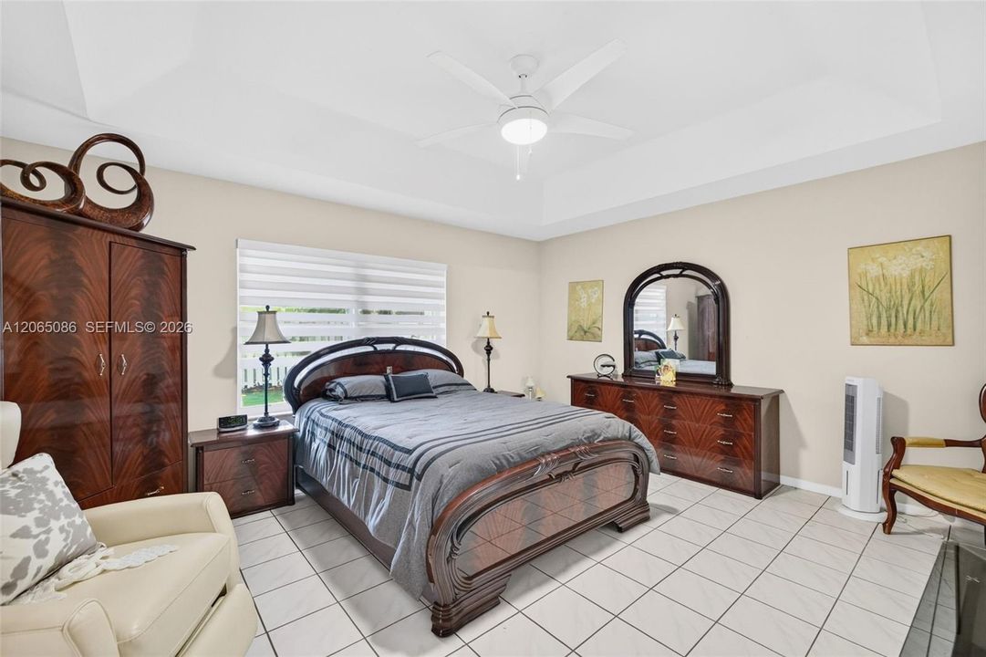 Tiled Primary Bedroom w/ Motorized Shade