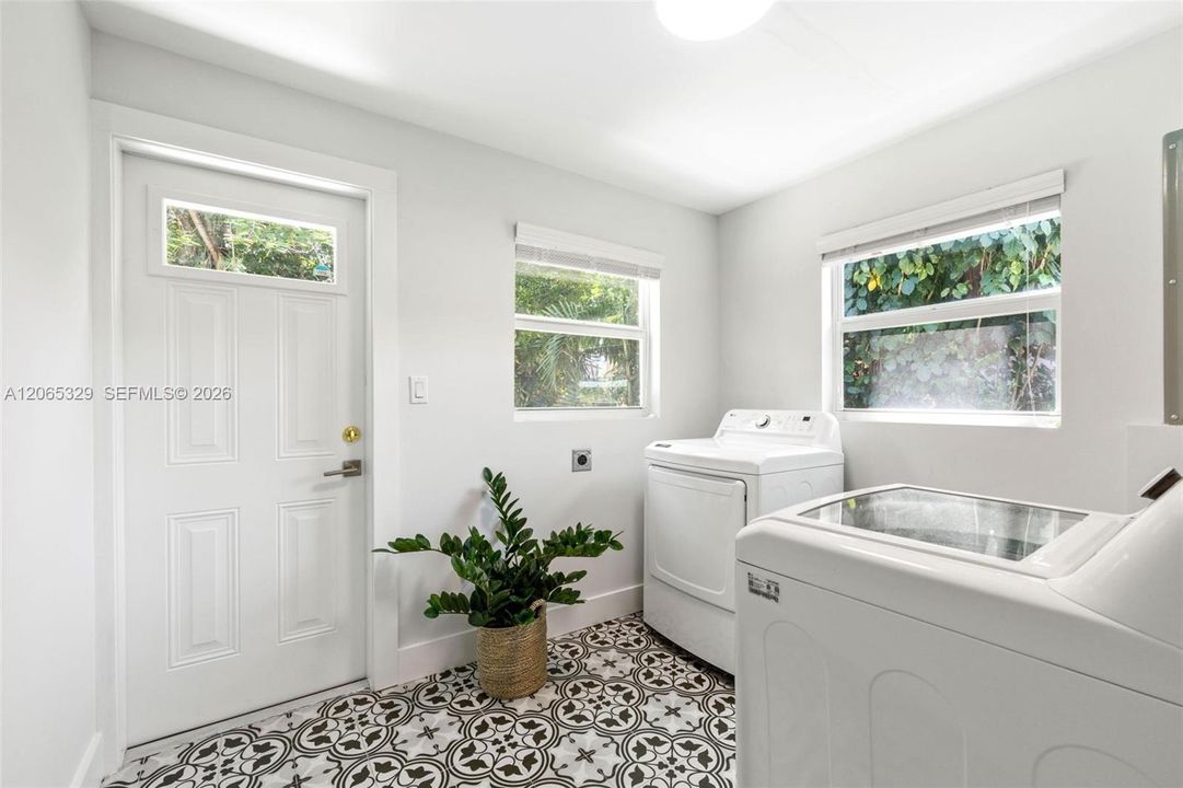 Then there are the practical spaces that make a house genuinely easy to live in: a dedicated laundry room with its own exterior access.