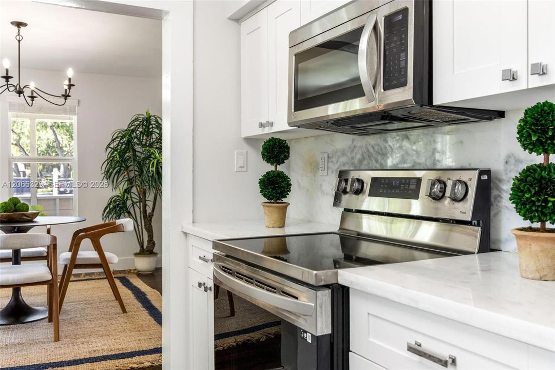 White cabinetry, stainless steel appliances