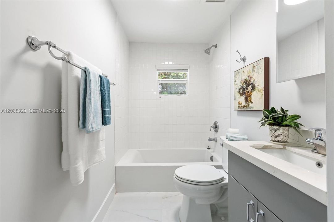 With a full tub and shower, because function matters just as much as the pretty parts.