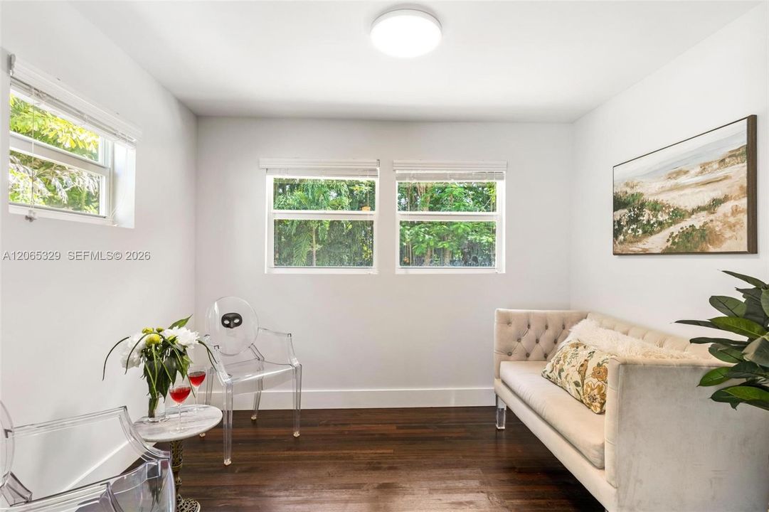 Nearby, another sun-filled room gives you options.