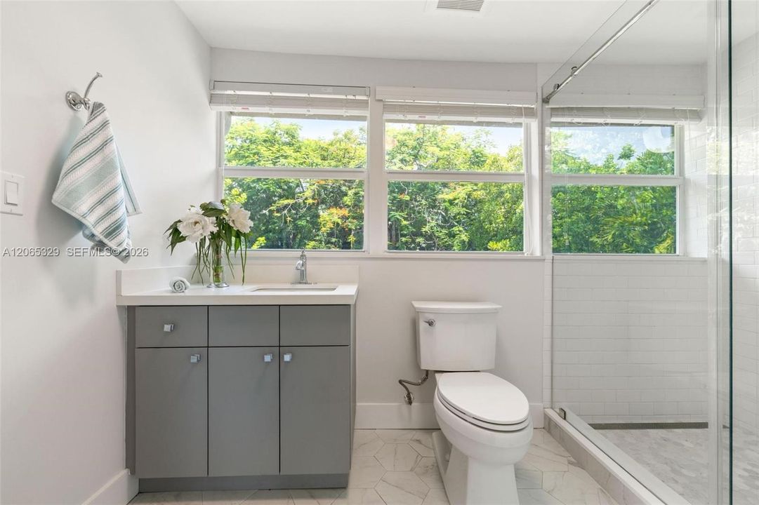 The second full bathroom brings in something we love: windows and natural light.