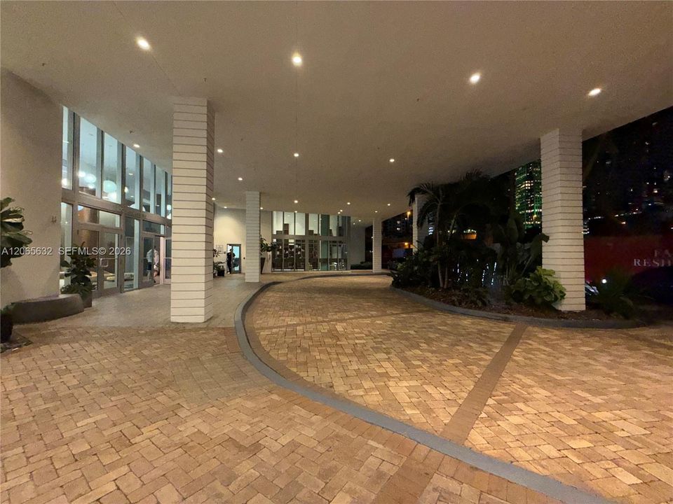 Covered driveway leading to the main lobby entrance