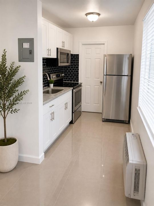 The unit is UNFURNISHED- This photo is VIRTUAL STAGED FOR VISUALIZATION