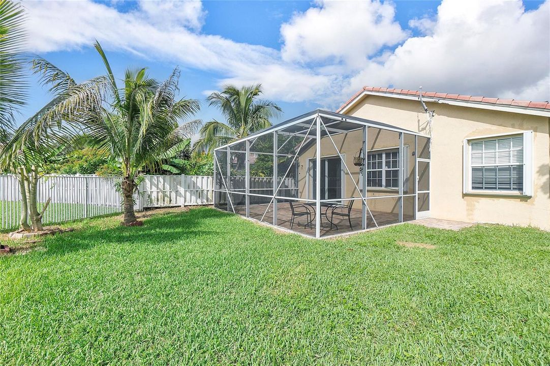 Yard with screened patio