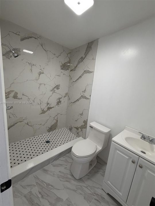 Updated full bathroom with spacious tiled shower