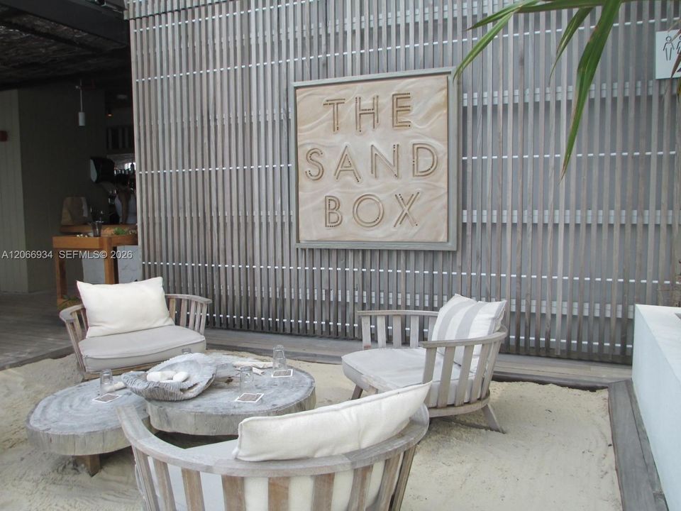 Sand Box dining at poolside.