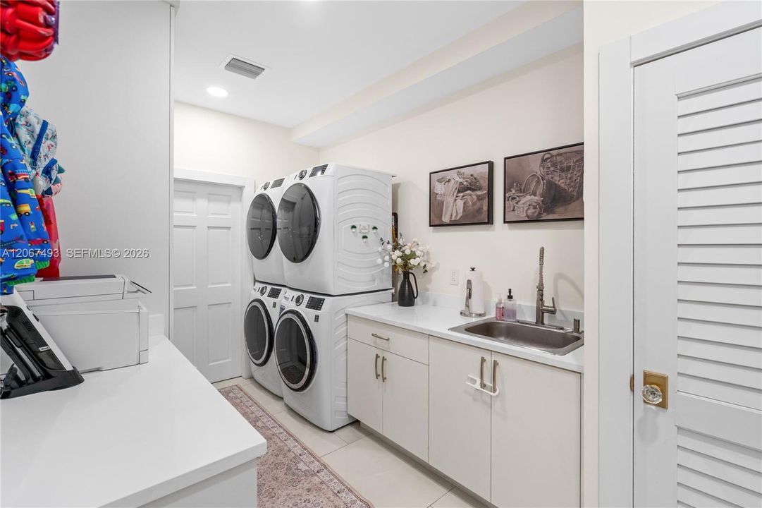 2 washers, 2 dryers, laundry tub
