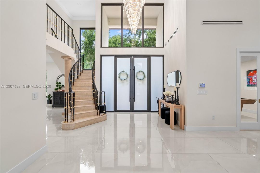 double height ceilings in entry/foyer/living room