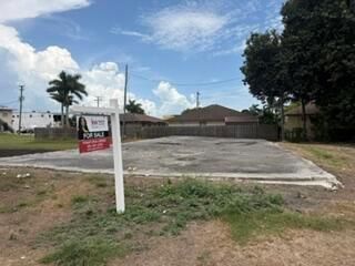 front of vacant land 4th St