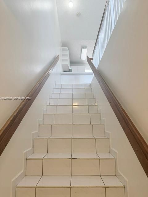 Stairs leading to Living area, kitchen, bedrooms and bathrooms