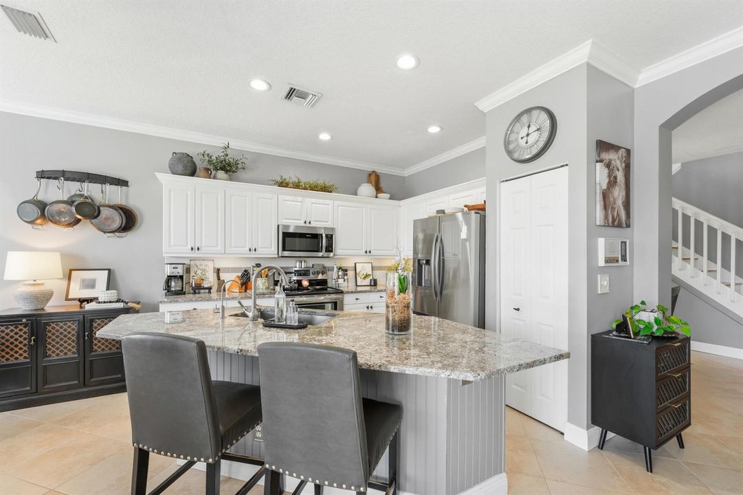 KITCHEN WITH ISLAND AND COUNTER SEATING