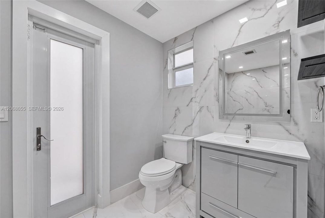 Interior and Exterior access to Guest Half Bathroom