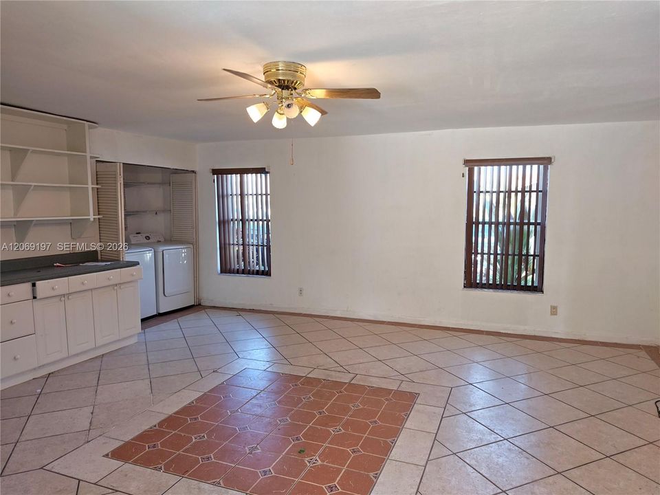 large den with washer and dryer, perfect for an extended family.