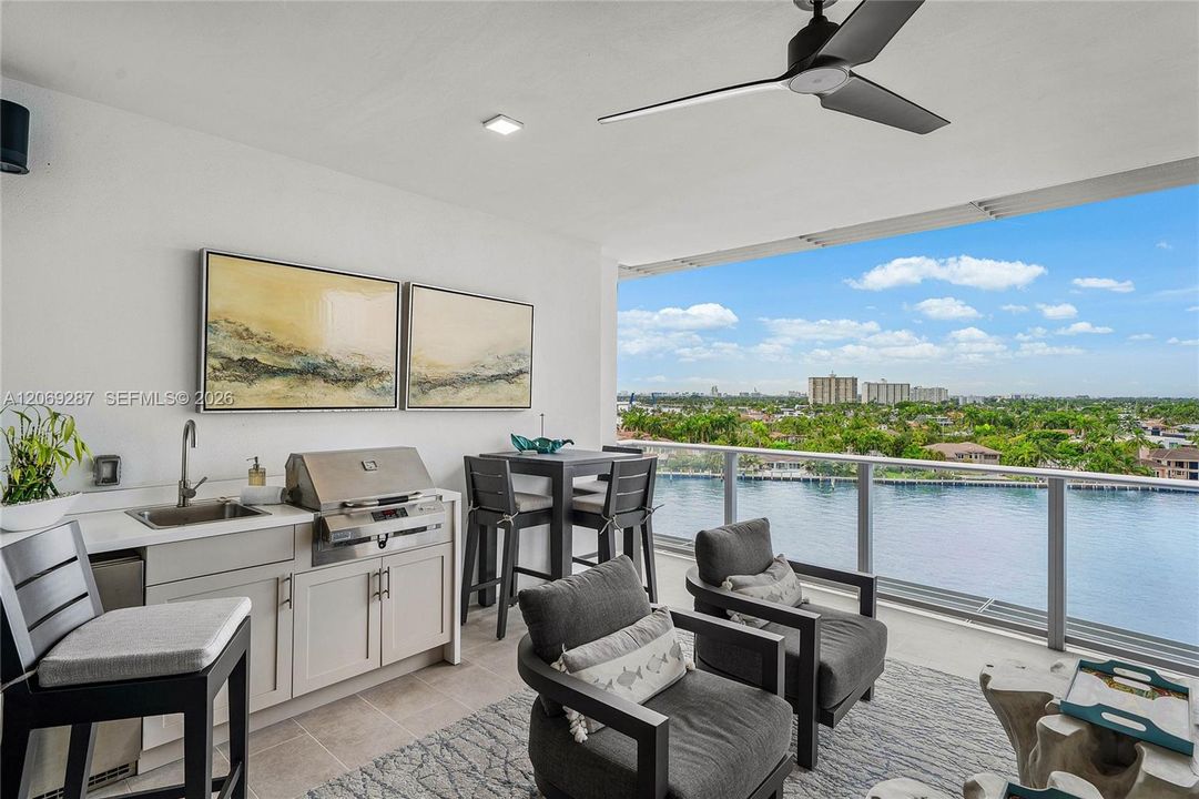 Expansive private terrace designed for outdoor living and entertaining, complete with a built-in gas grill.