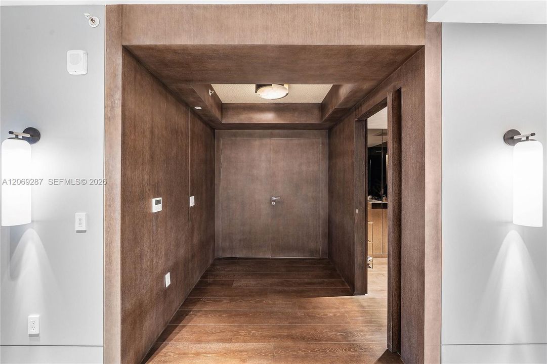 An elegant private elevator foyer provides a discreet and impressive arrival directly into the residence.