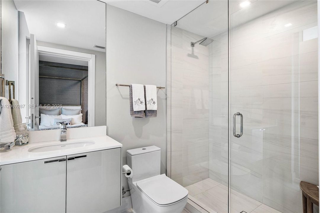A well-appointed third bedroom with a private en-suite bathroom, providing comfort and privacy