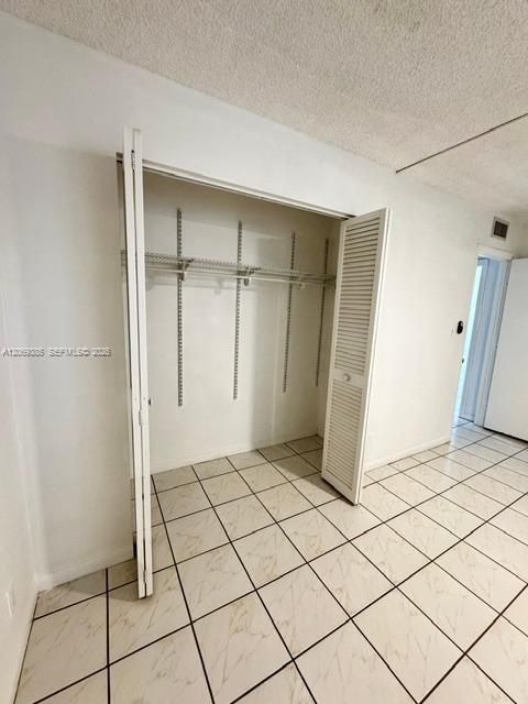2nd bedroom closet with adjustable shelving