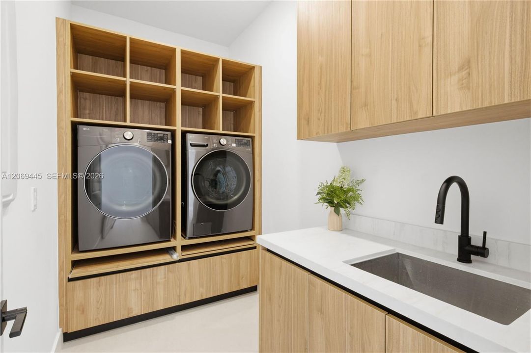 Additional features include stylish laundry room w/ custom cabinetry, utility sink, washer & dryer, designer lighting throughout, modern interior doors, floating vanities, upscale plumbing fixtures, custom built-in closet systems, extensive storage & meticulous attention to detail in every room