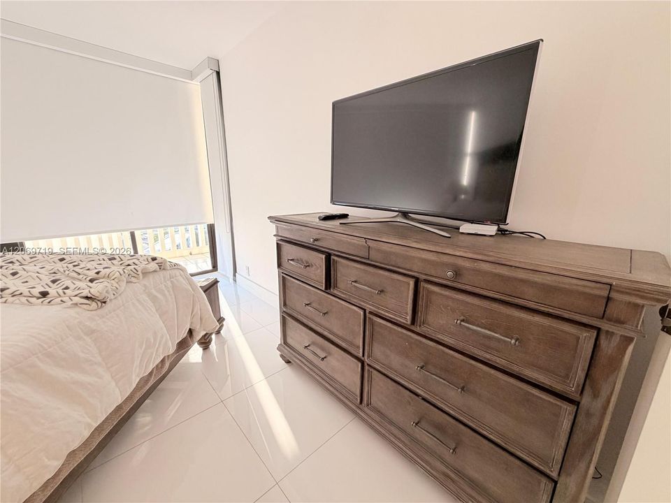 Bedroom #2 with plenty of storage and TV.