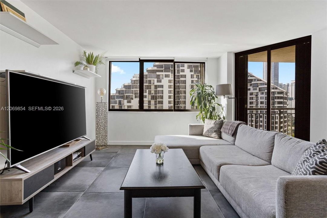 This stunning open-concept space is designed for both functionality and style. The extra-large island features additional storage beneath, offering plenty of room for kitchen essentials and organization. A conveniently located closet next to the island provides even more storage options, ensuring a clutter-free living experience.