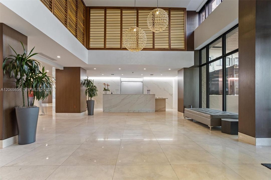 flooring, high ceilings, and contemporary lighting accents, every detail has been curated for a refined ambiance. Enjoy the convenience of 24-hour concierge service, ensuring personalized assistance and security at all times. Additionally, valet parking provides seamless arrivals and departures, elevating the experience of effortless luxury living