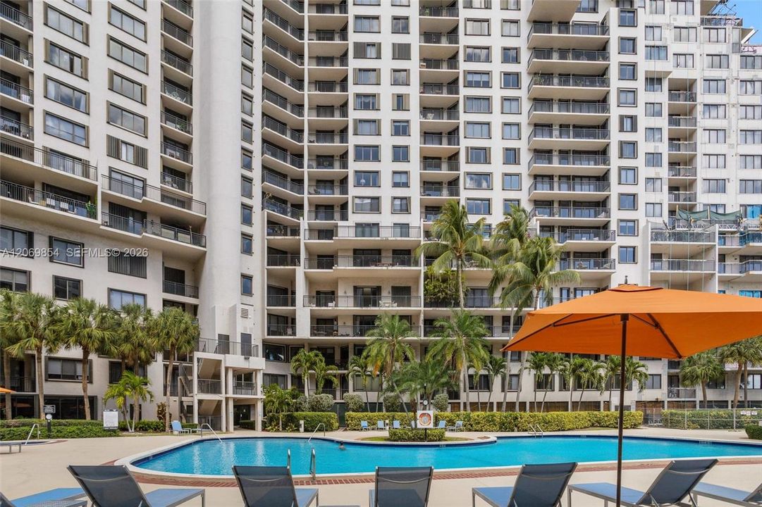 Immerse yourself in luxury with this stunning resort-style pool area, surrounded by lush tropical landscaping and swaying palm trees. Designed for relaxation and entertainment, this exclusive amenity includes a grand barbecue area perfect for outdoor gatherings. Enjoy direct access to a scenic jogging and walking pathway along Biscayne Bay, offering breathtaking waterfront views and a serene escape into nature. Whether you're unwinding by the pool, soaking in the hot tub, or taking in the fresh ocean breeze