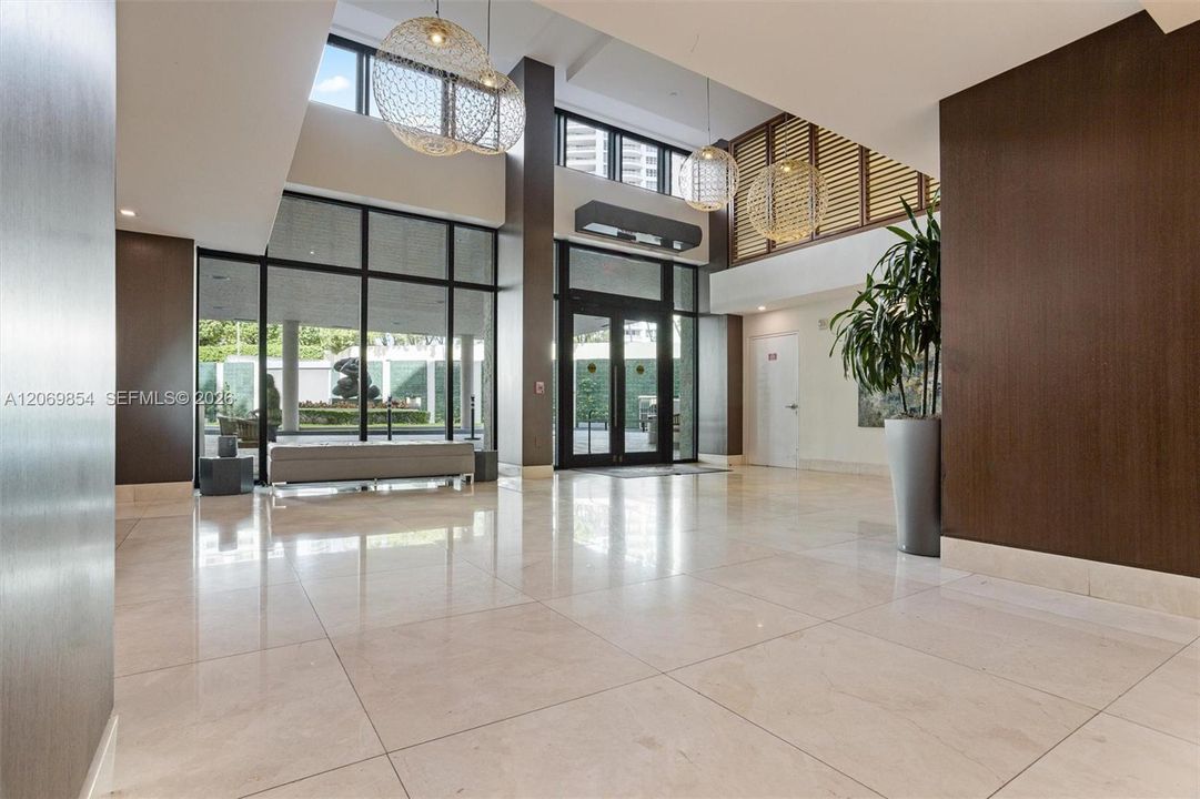 Step into luxury as you enter this beautifully remodeled lobby, designed to impress with its modern elegance and sophisticated ambiance. This grand entrance sets the tone for upscale living. Enjoy the convenience and security of a 24-hour concierge service, ensuring personalized assistance and peace of mind around the clock. Thoughtfully designed with contemporary finishes and stylish details, this welcoming space offers the perfect blend of comfort and exclusivity