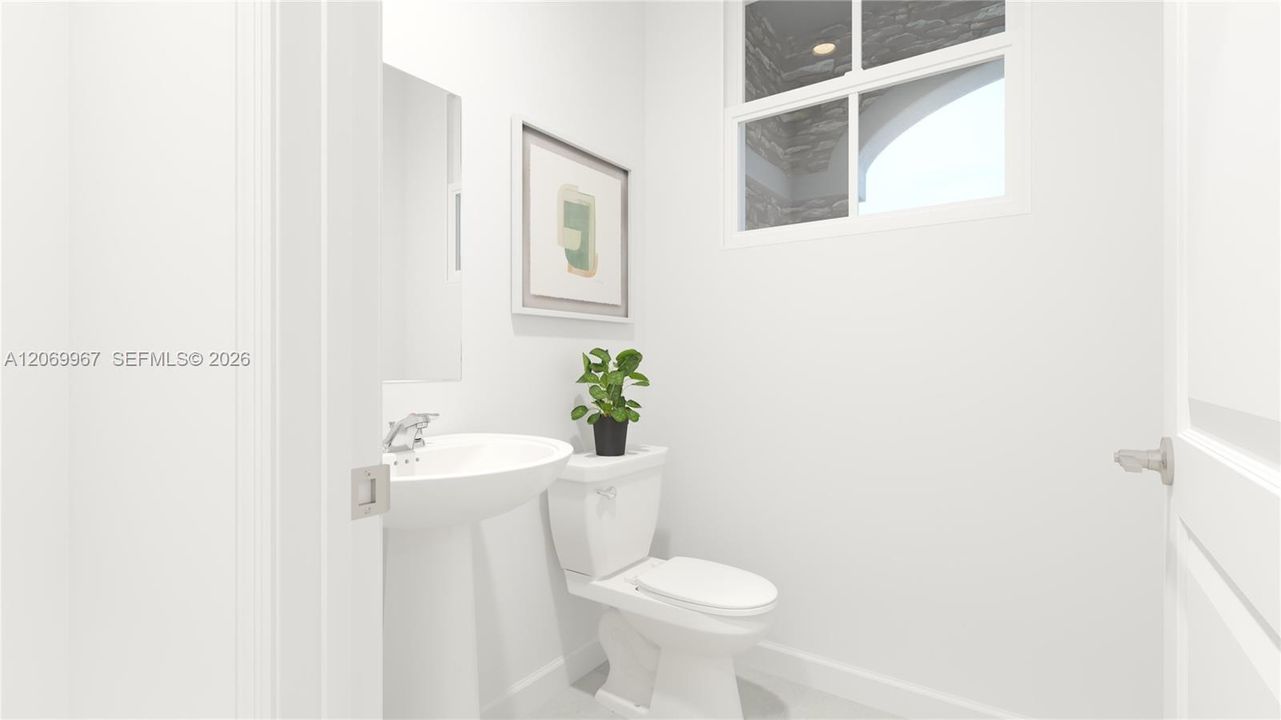 Right off the entryway is a powder room to readily accommodate the needs of the whole household and visiting guests.