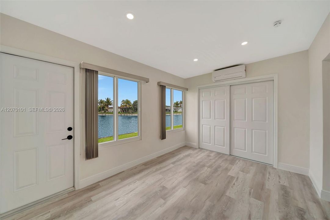 Second lake-access room, full closet doors