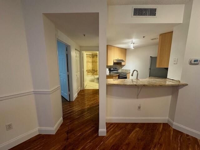 CP view of kit, bath and hallway