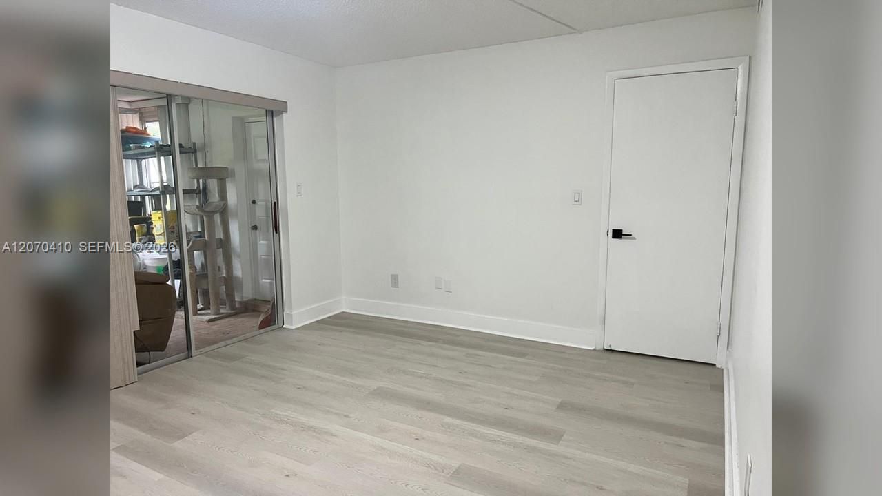 Primary Bedroom, Sliding Glass Door to Enclosed Porch
