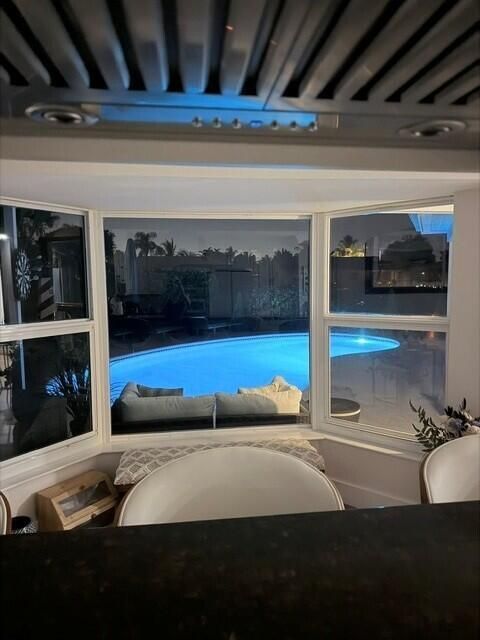 View from Kitchen Bay Wondow Night Pool