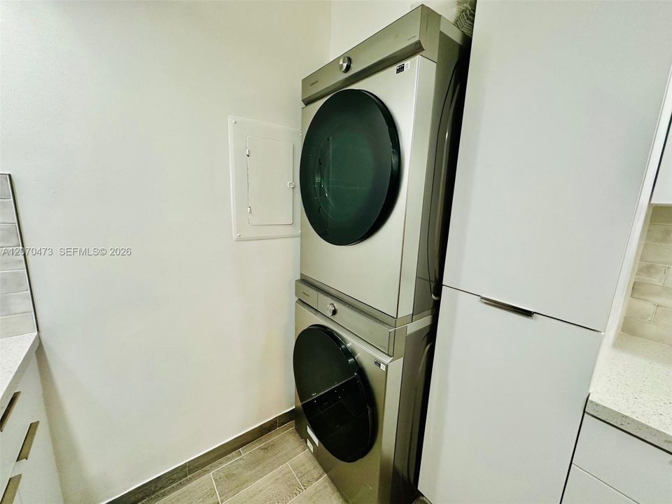 NEW STAINLESS STEEL WASHER AND DRYER.