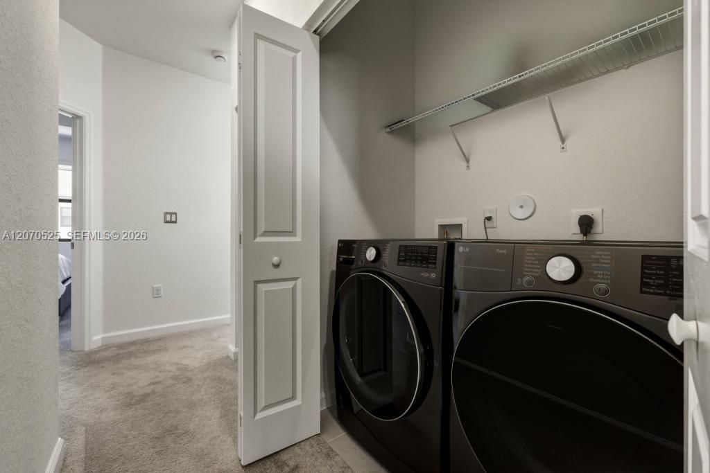 The laundry area is conveniently located on the same floor as the bedrooms.