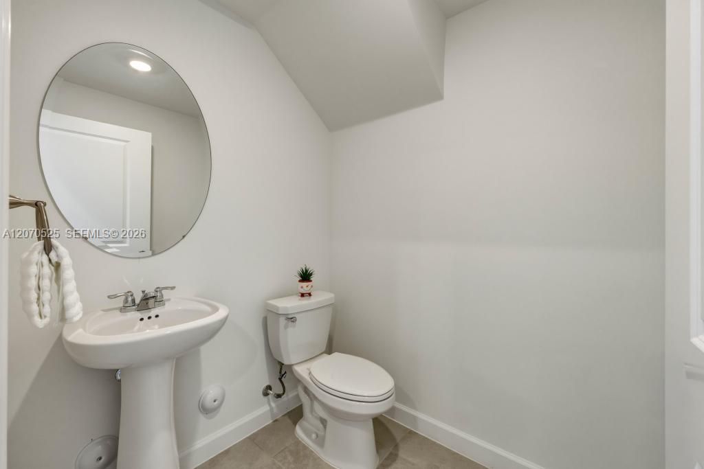There's also a conveniently located half bathroom downstairs.