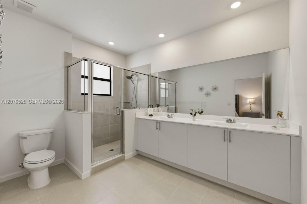 Walk directly from your bedroom into a large private bathroom.