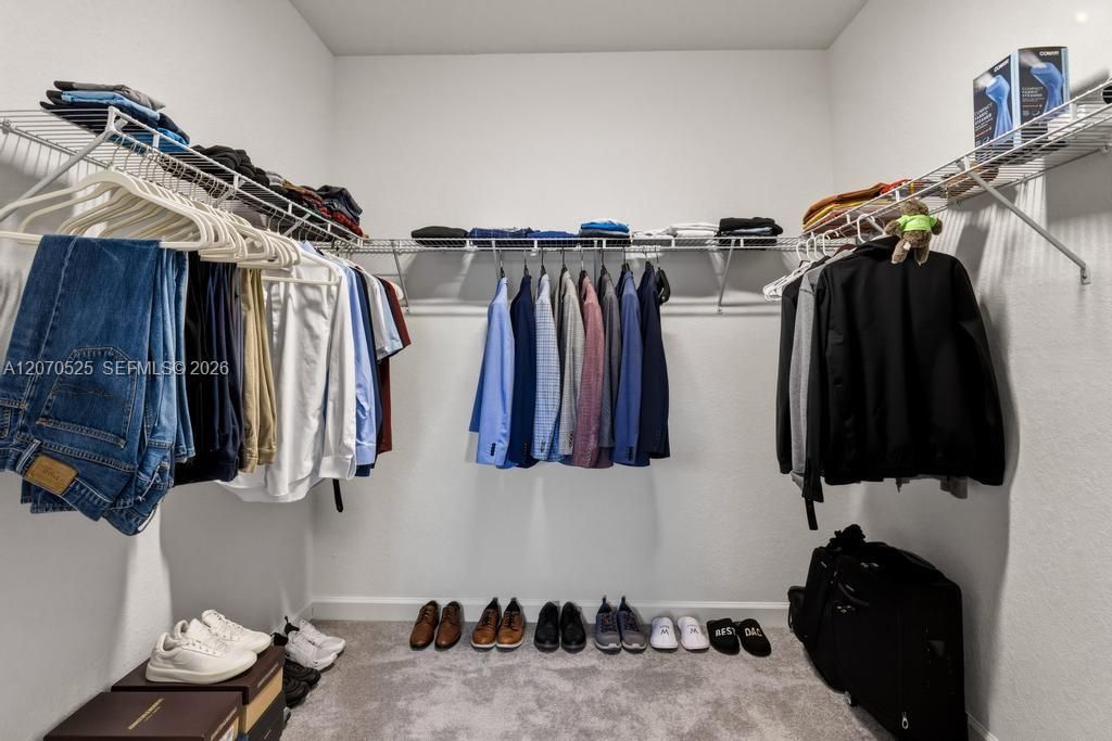 Walk directly from your bedroom into a large private bathroom.