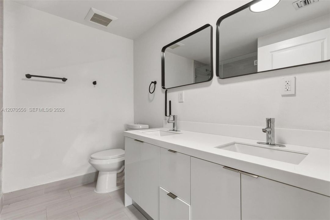 A spacious double vanity gives you extra counter space, storage, and room to make busy mornings feel a little easier.