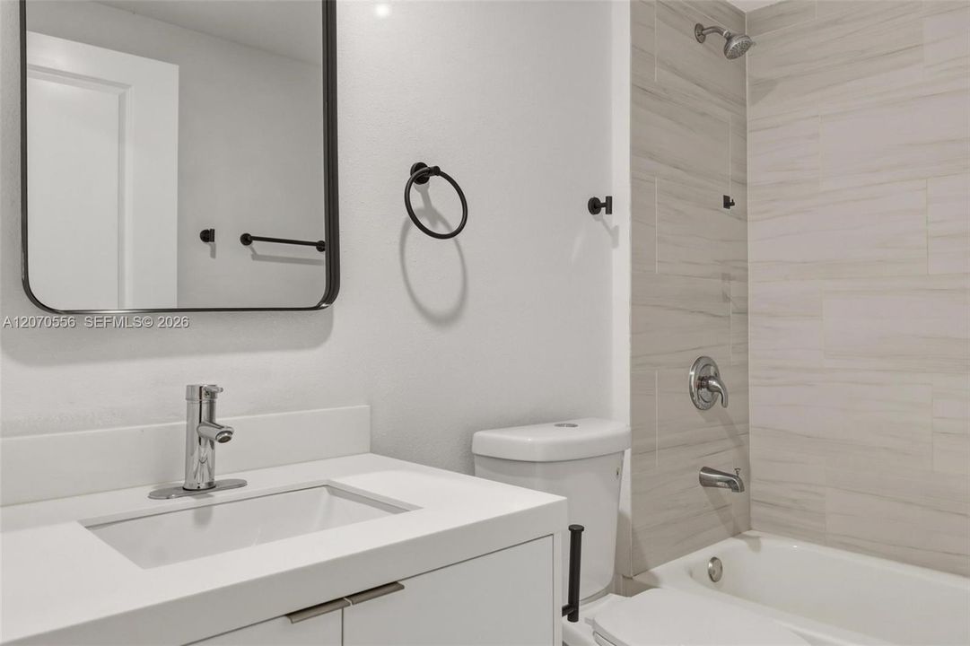 Clean, bright, and thoughtfully finished with a full bathtub and shower.