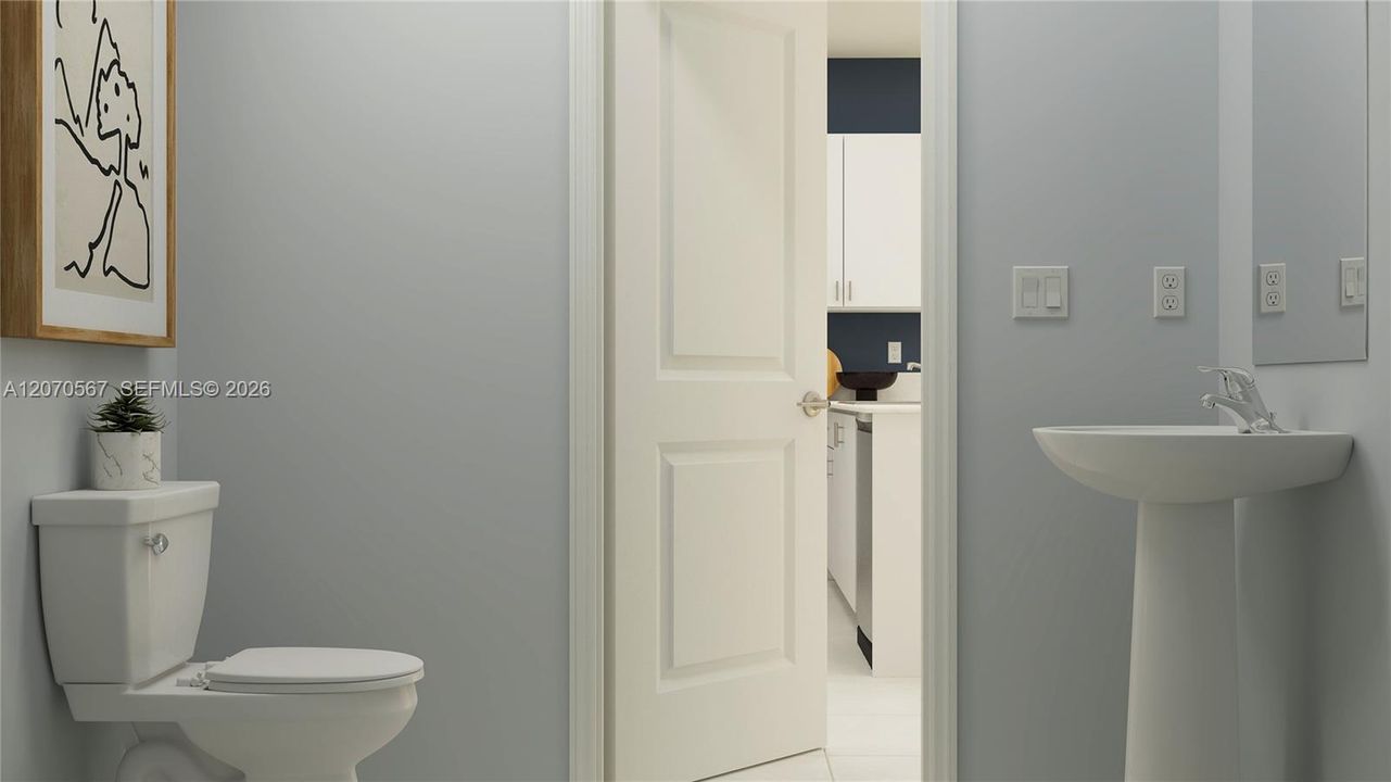 The powder room is tucked away off the living area for convenient access at any time of day.
