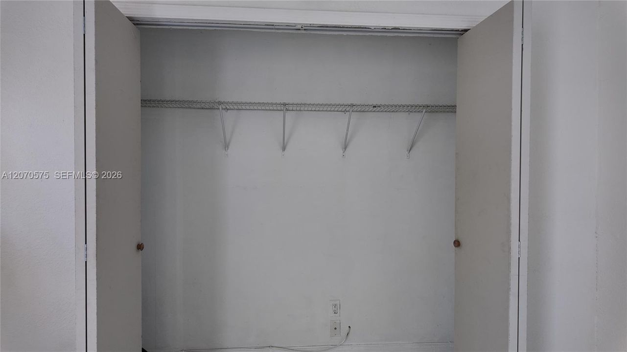 a separate sleeping area with a large closet...