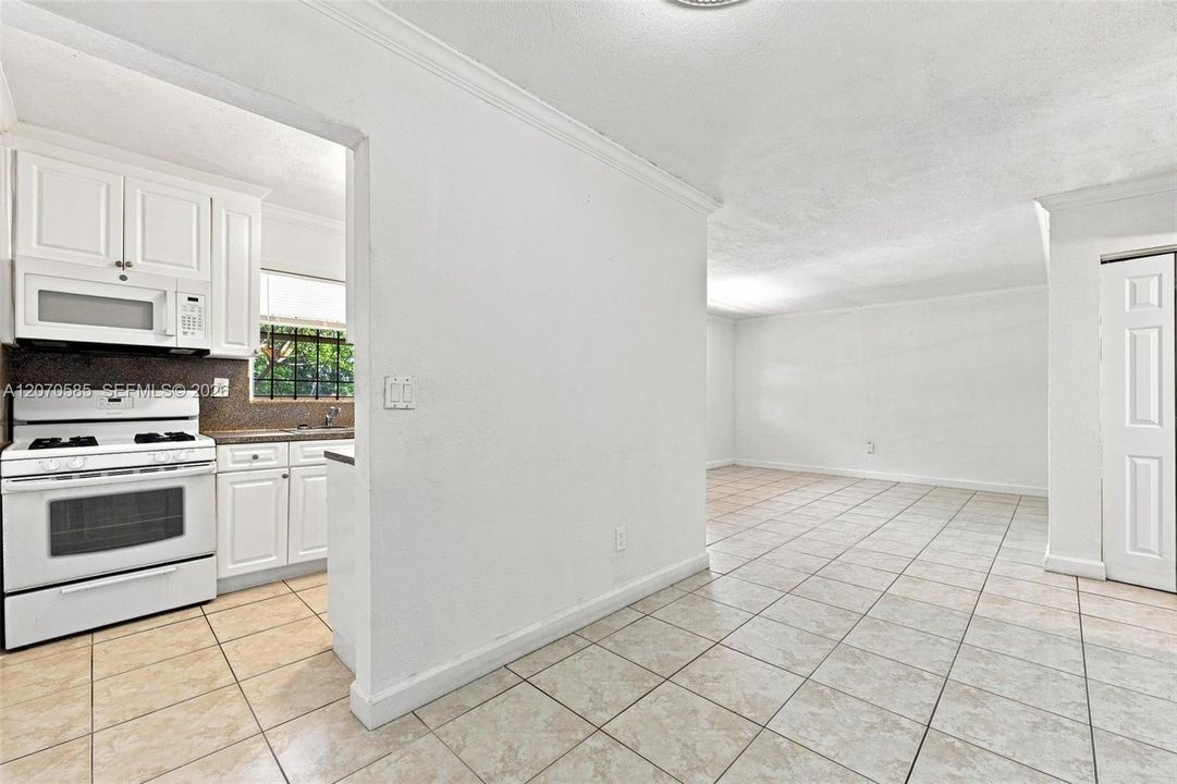 A separate kitchen keeps the cooking space defined while still connecting easily to the rest of the home.