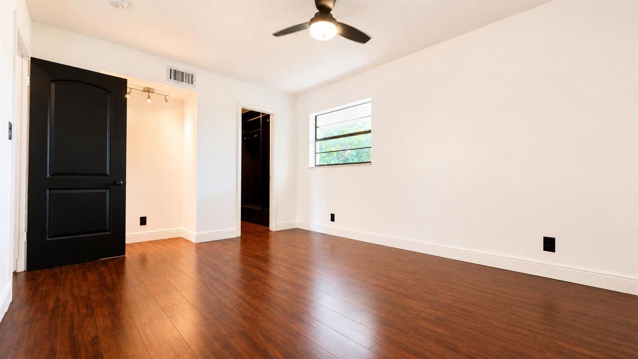 Bright Master Bedroom with Studio Area