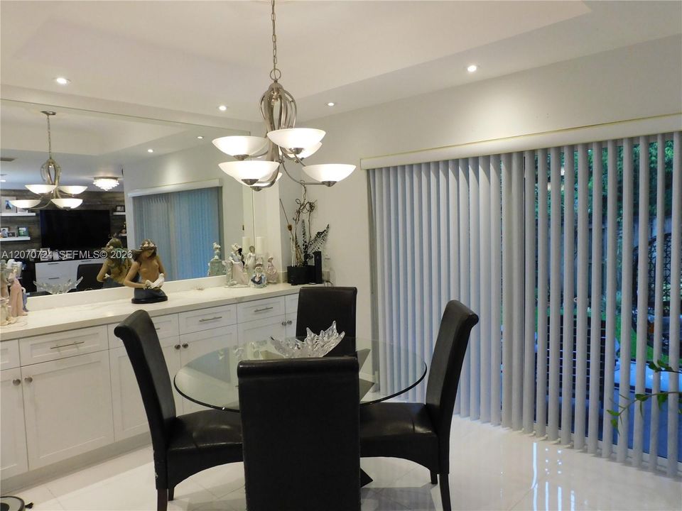 Dining area with view to covered terrace patio.