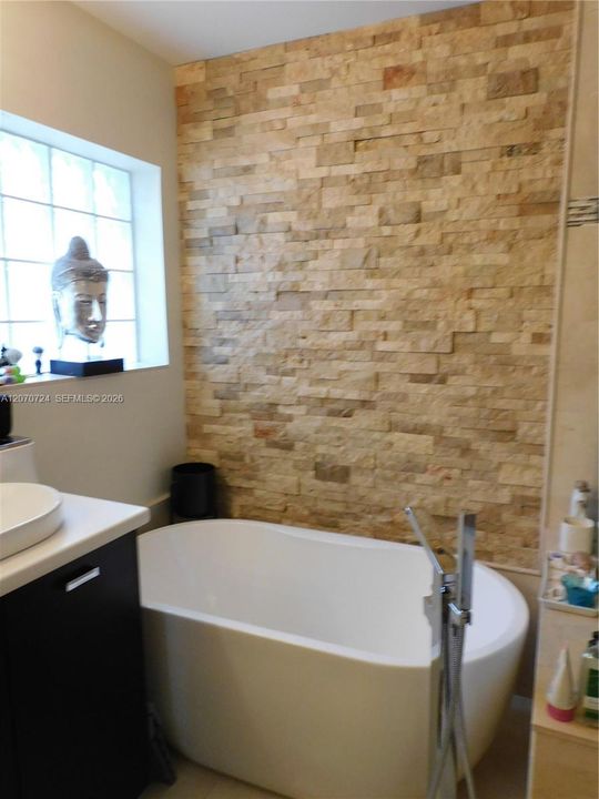 Glass Blocks bring in natural light with privacy when enjoying peaceful relaxation.